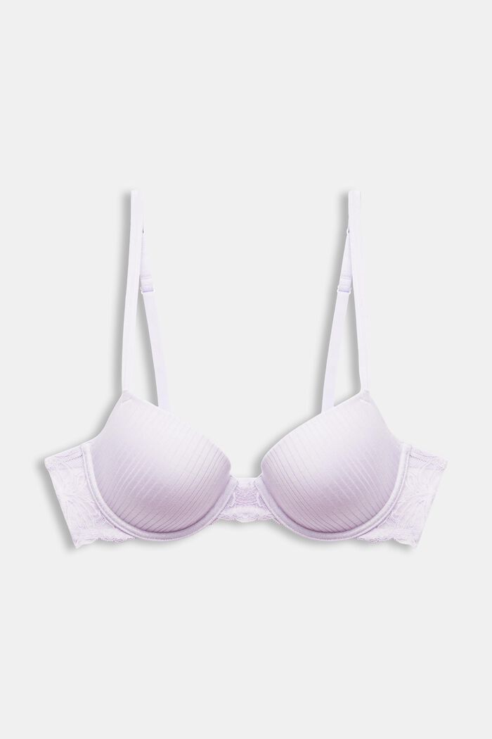 Foto de White new bra on a violet background. Bra, lace lingerie
